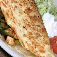 Quesadilla Fajita Grande · Grilled with onions, bell peppers and tomato garnished with lettuce, sour cream and tomato.