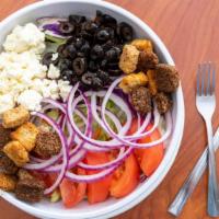 Greek Island Salad · Salad blend, purple onion, black olives, feta cheese, croutons and your choice of dressing.