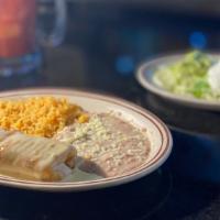 Chimichangas · Flour tortilla rolled up and stuffed with beef or chicken, deep-fried and a with hot cheese,...