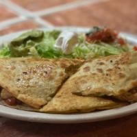 Fajita Quesadilla · A large flour tortilla filled with grilled chicken, shrimp or beef, peppers, onions, and tom...