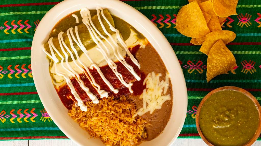 Enchiladas Mexicanas · Three chicken enchiladas topped with red sauce, lettuce, tomatoes, sour cream and guacamole. Served with rice and beans.
