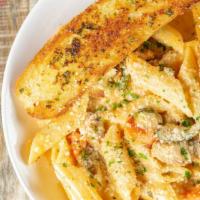 Elizabeth Pasta · Penne pasta, blackened chicken, roasted vegetables, cajun cream sauce.