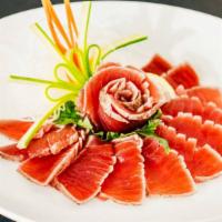 Tuna Tataki · Seared tuna and ponzu sauce. This item contains raw fish. Consuming raw or undercooked meats...