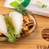 Bao Buns · Soft fluffy Bao Buns stuffed with your choice of protein; topped with cucumber, cilantro, ki...