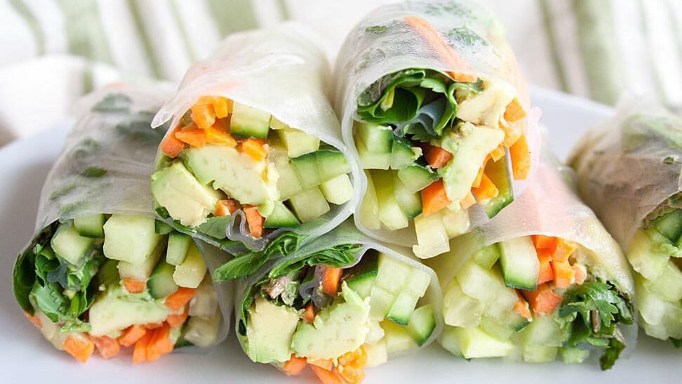 Fresh Veggie Spring Rolls / Goi Cuon Chay · 2 pieces.  Spring rolls filled with tofu, vermicelli, mixed fresh herbs, cucumber, and dip in dipping sauce.