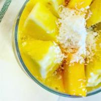 Tropical Daze · Mango, pineapple, banana, coconut milk, agave, coconut flakes (24oz)