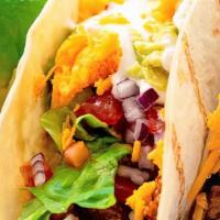 Beef Tacos (2) · Soft flour tortillas, spicy ground beef shredded lettuce, shredded cheese, pico de gallo. Ad...