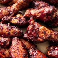 15 Jumbo Smoked Wings  · Wood smoked then grilled or fried to order -smoked & Blackened or tossed with Bill's BBQ Sau...