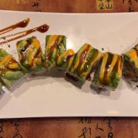 Caterpillar Roll · Shrimp tempura with avocado inside, topped with sauce with avocado.