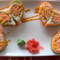 Valentines Roll · Spicy crabmeat inside, salmon and tuna with avocado on the top in a heart shape.