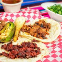 Tacos · soft corn tortilla with your choice of meat served with onion, cilantro and limes with green...
