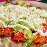 Enchiladas Rojas · Stuffed with Queso Fresco and chopped onion or chicken, topped with red salsa served with a ...