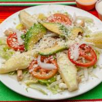 Ensalada De Pollo (Grilled Chicken Salad · Iceberg lettuce with grilled chicken topped with Queso fresco, tomatoes, cucumbers, and avoc...