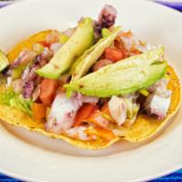 Tostada De Ceviche · Pulpo (octopus), camarón (shrimp) or Pescado (fish). Marinated with lemon juice, mixed with ...