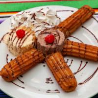 Churros · Two churros served with vanilla icecream and whipped cream