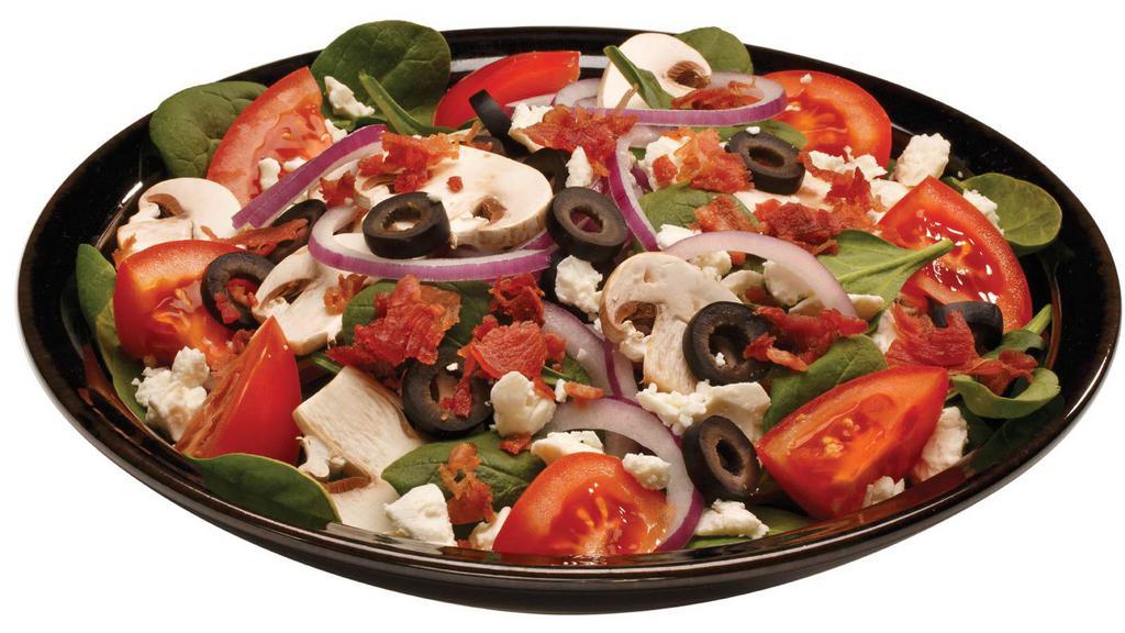 Regular Mediterranean Salad · Inspired by the Italian coast, we toss fresh greens with red onions, roasted red peppers, black olives, tomatoes, and banana peppers. Finished with Feta and Pecorino Romano cheeses.