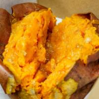Exposed Sweet Potatoes · Filled with plant based butter and brown sugar.