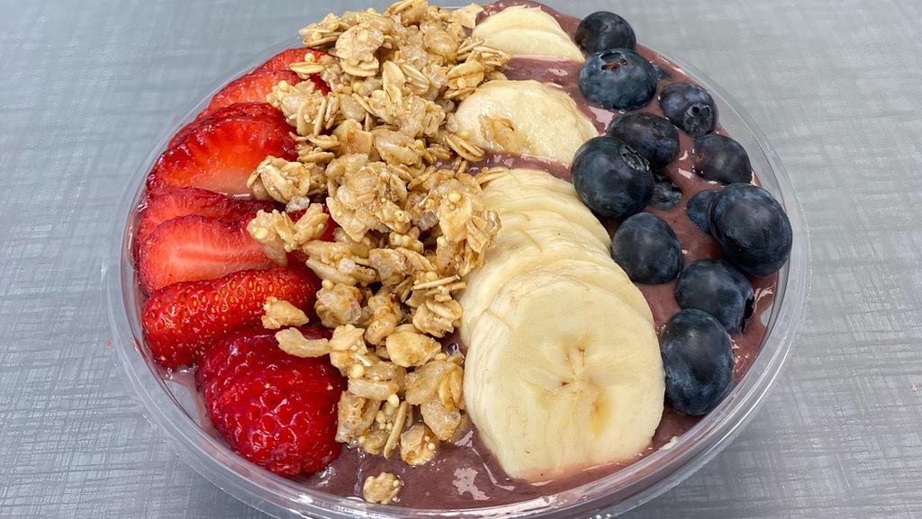 Peanut Butter Bowl · mixed frozen acai, strawberries, bananas, peanut butter in almond milk topped with granola, fresh strawberries, bananas and blue berries.