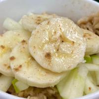 Oatmeal Topped With Green Apples And Bananas · Old fashion oats cooked in almond milk mixed with cinnamon and brown sugar topped with green...