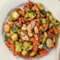 Kung Pao Chicken · Hot and spicy. Tender chicken sautéed with vegetables, peanuts in hot spicy sauce.