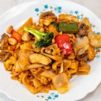 Pad Kee Mao (Drunken Noodle) · Spicy. Wide rice noodle stir fry with basil, bell peppers, onions, carrots, and choice of me...