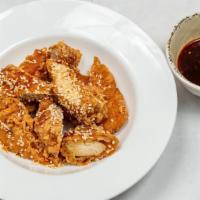 Sesame Chicken · Spicy. Whole chicken breast battered and fried with special hot sauce. Seasoned with sesame ...