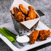 Bone-In Wings · Hand-tossed in choice of sauce: house BBQ, buffalo, honey-chipotle. Served with celery and d...
