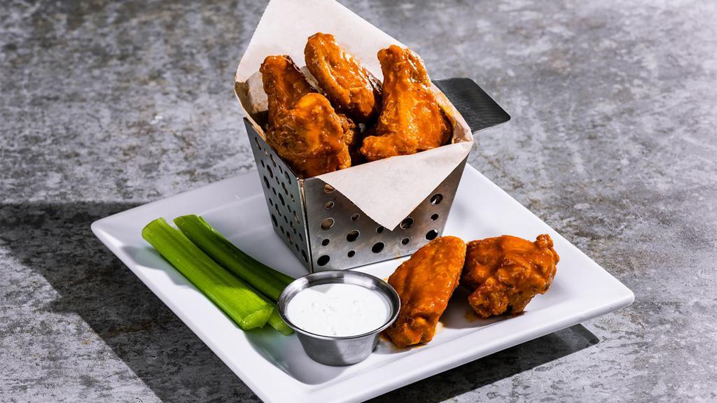 Bone-In Wings · Hand-tossed in choice of sauce: house BBQ, buffalo, honey-chipotle. Served with celery and dipping sauce. 800-1000 cal.