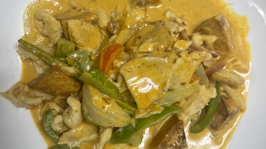 Yellow Curry · Spicy. Potato, sweet potato, bell pepper and onion w. Coconut milk sauce.