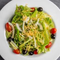 House Salad · Iceberg lettuce, onion, green peppers, tomatoes, black olives, Mozzarella and Cheddar cheeses.