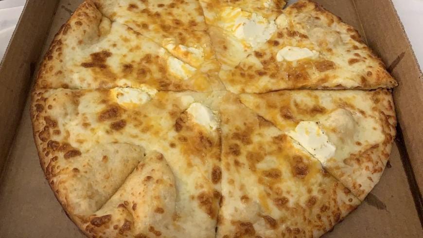 Seven Cheese Pizza · Mozzarella, shredded Parmesan, Parmesan, Feta, cheddar and Provolone.