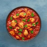 Chicken Madras Murgun · A chicken dish prepared in a reduced tomato, green-chilli, bell peppers onion and Indian spi...