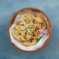 Garlic Garlic Naan · House made pulled and leavened dough loaded with fine chopped garlic and baked to perfection...