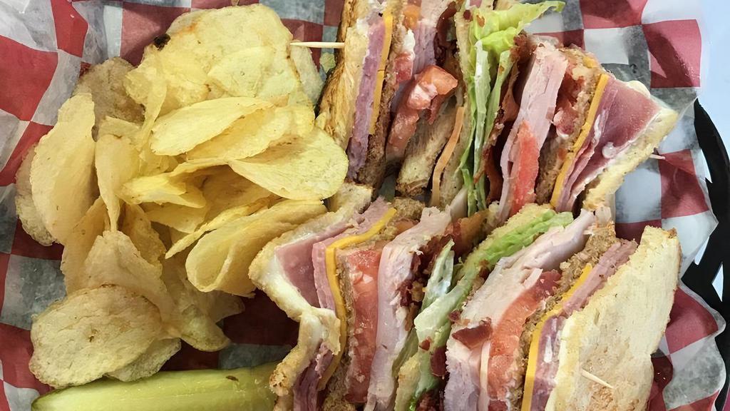 Club Sandwich · Triple decker with smoked turkey, ham, bacon on toasted bread with lettuce, tomato, cheese and mayo.