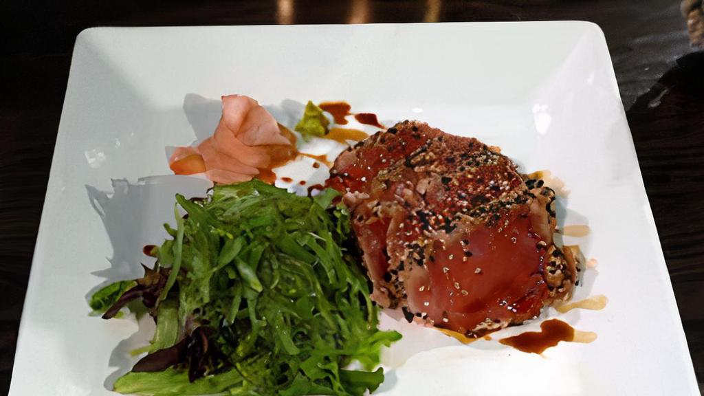 Seared Black Pepper Tuna · Seaweed salad, and seared black pepper tuna with wasabi yuzu sauce.