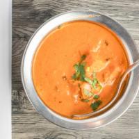 Chicken Tikka Masala · Cubes of tandoori grilled chicken cooked in creamy sauce with tomato and mild spices
