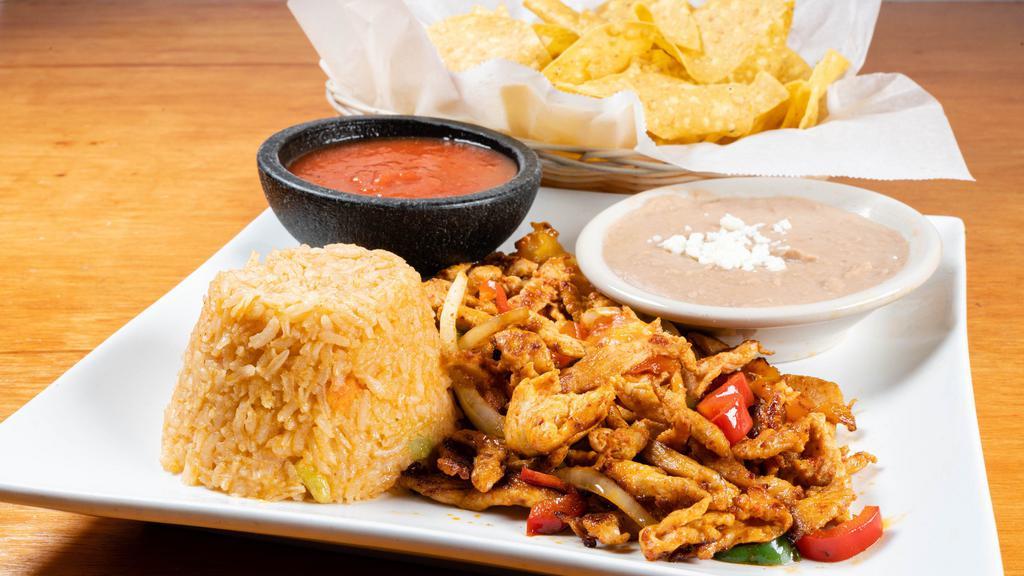 Lunch Fajitas · Steak or chicken grilled with tomatoes, bell peppers, and onions served on a gigantic bed of crispy tortilla chips covered in nacho cheese.