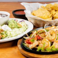Shrimp Fajitas · Grilled shrimp with tomatoes, bell peppers, and onions. Served with rice and beans.