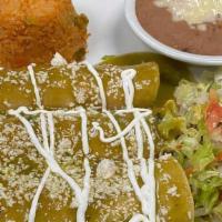 Enchiladas Verdes · Three chicken or beef enchiladas topped with green tomatillo sauce with cheese, lettuce, and...