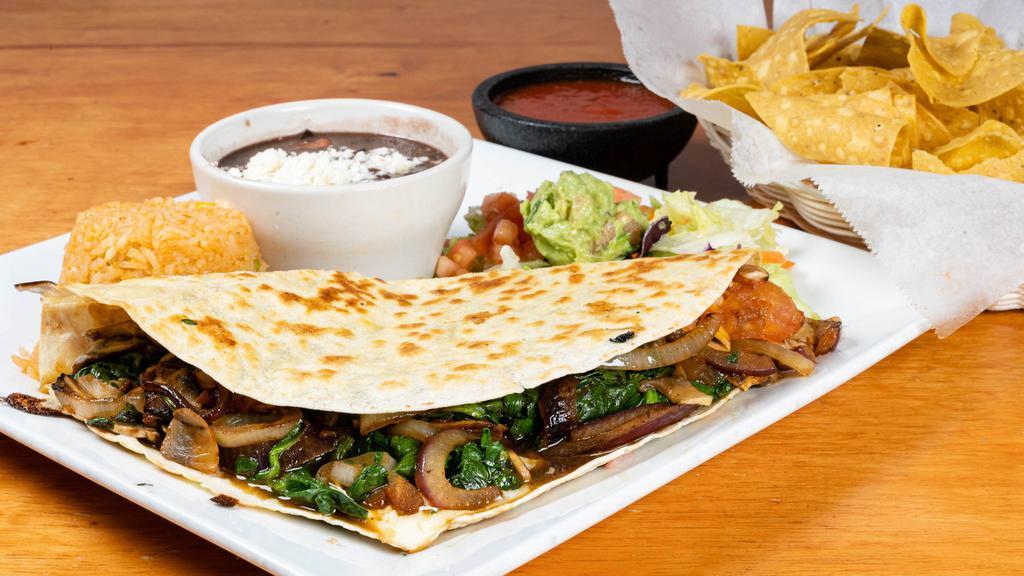 Spinach Quesadilla · Large flour tortilla filled with grilled spinach and cheese. Served with rice, beans, and guacamole salad.