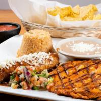 Pollo En Adobo · Chicken breast topped with adobo sauce, cheese dip. Served with rice, beans, and cream salad.