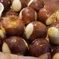 Pretzel Bites · Olive oil and garlic basted pretzel bites with choice of dipping sauce - Studwizer beer chee...