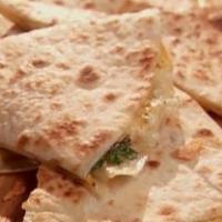 Cheese Quesadilla · A flour tortilla filled with melted cheese. Served with rice and beans.