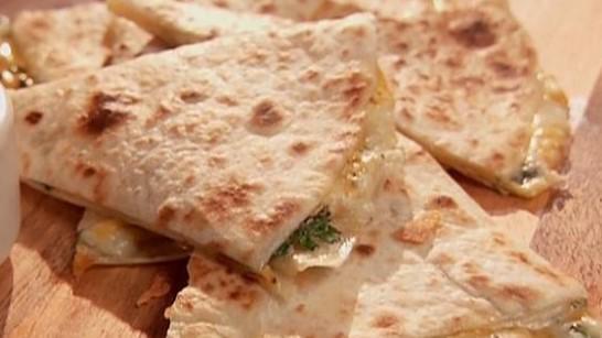 Cheese Quesadilla · A flour tortilla filled with melted cheese. Served with rice and beans.