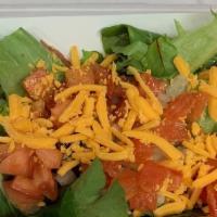 Side Salads · Spring mix lettuce topped with shredded cheddar and tomatoes