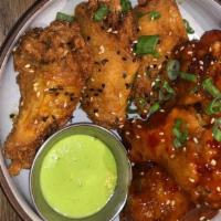 Mofu Wings (7 Count) · Our crispy chicken wings tossed in your choice of sweet chili sauce, Nuocmam Lime Glaze, or ...