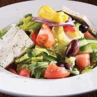 Classic Greek Salad · Vegetarian. Gluten-free. Crisp romaine lettuce, tomatoes, cucumbers, peppers onions, feta, k...