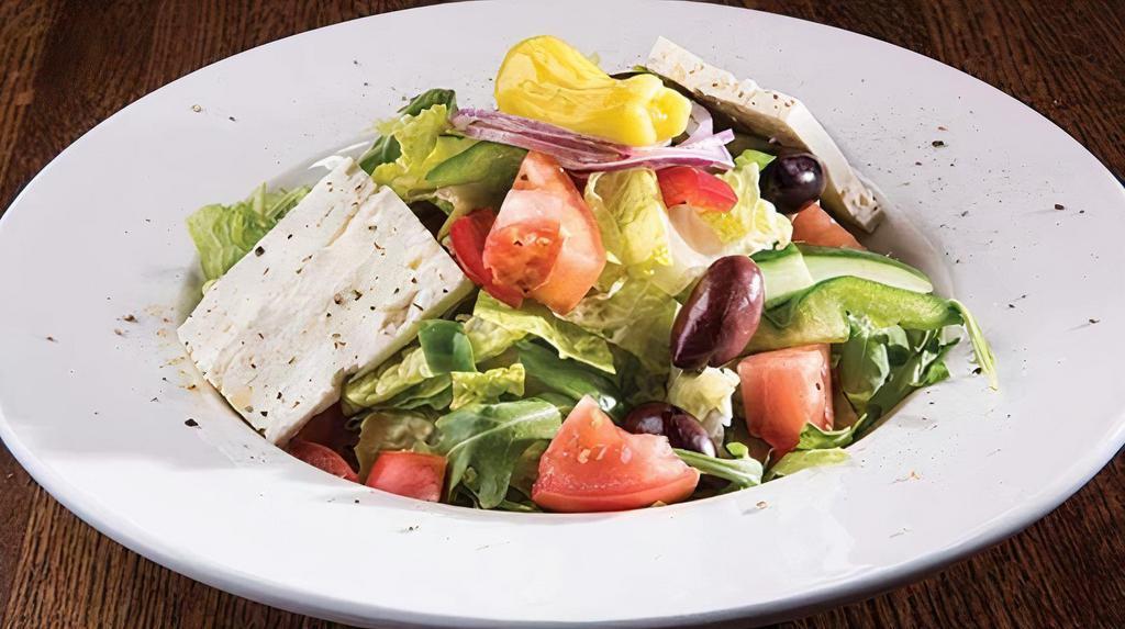 Classic Greek Salad · Vegetarian. Gluten-free. Crisp romaine lettuce, tomatoes, cucumbers, peppers onions, feta, kalamata olives, salt, pepper, oregano, and kephi dressing. Add protein for an additional charge.
