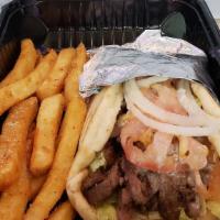 Kephi Gyro · Hand-carved lamb and beef wrapped in grilled pita with tomatoes, onions, lettuce, and tzatzi...