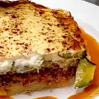Moussaka · Layers of sautéed eggplant, sliced potatoes, aromatic spiced beef with bechamel and topped w...